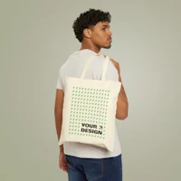 a man wearing a green tote bag mockup